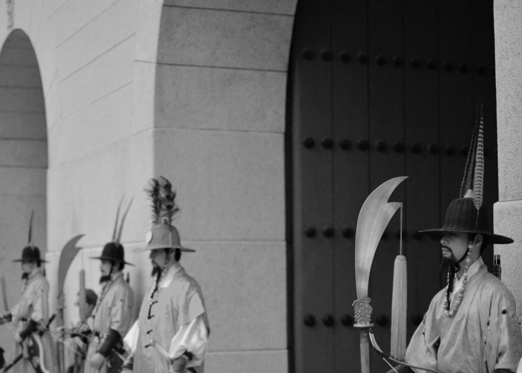 unique things to do in seoul - Palace guards standing with ancient weapons 